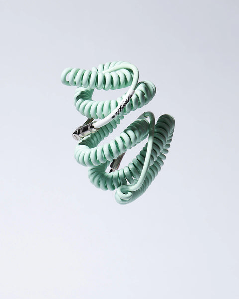 Surf Green coiled guitar cable flying product photo Voltage Vintage Coil®