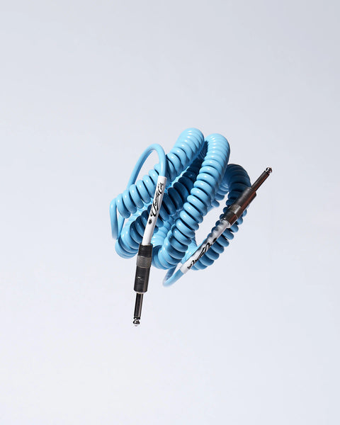 Electric Blue coiled guitar cable flying product photo Voltage Vintage Coil®