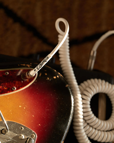  White curly guitar cable on vintage amp