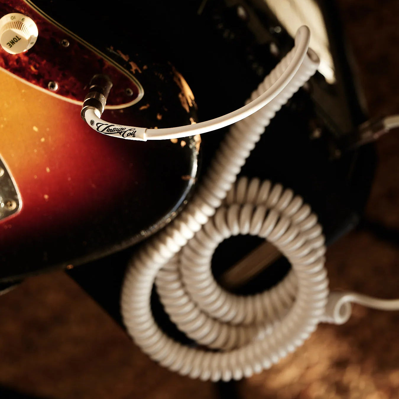  White curly guitar cable on vintage amp